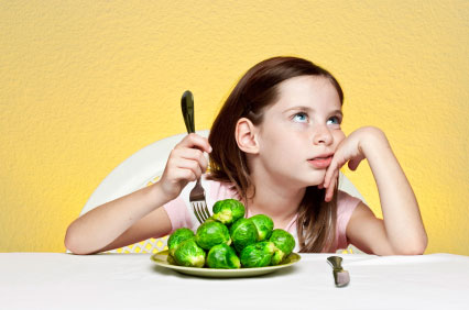 kid hates vegetables, bored kid, kid eating, girl eating